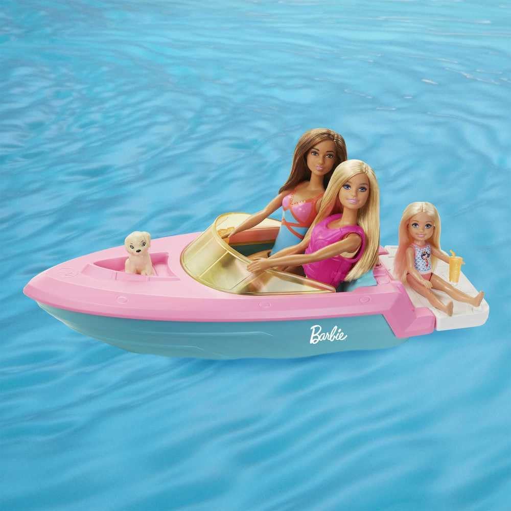 Muñeca Barbie y juego de barco con cachorro, chaleco salvavidas y a...