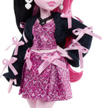Muñeca Monster High, Draculaura en vestido de lazo rosa y chaqueta...